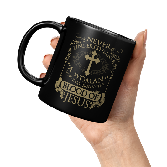 COVERED_BY_THE_BLOOD_BLACK_11OZ_MUG_11oz_Black_LH_Model_Mockup.png_3665025