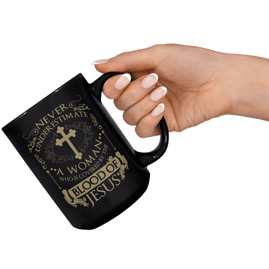 Covered__by_the_blood_15oz_15oz_Black_RH_Model_Mockup.png_15585330
